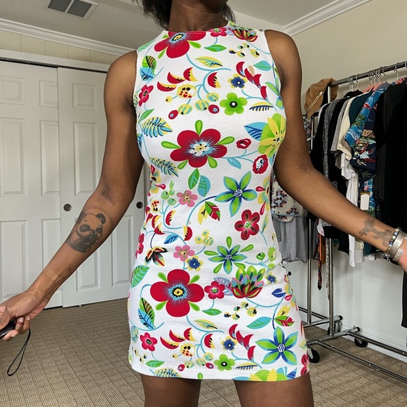 Vintage dress. Stretchy material. Vibrant colors. Size medium. Few stains. - Picture 2 of 5